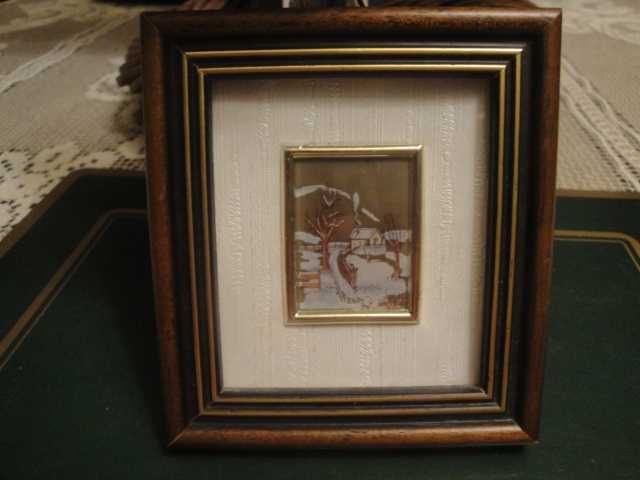 Mały obrazek w ramce z certyfikatem gwarancji wykonania