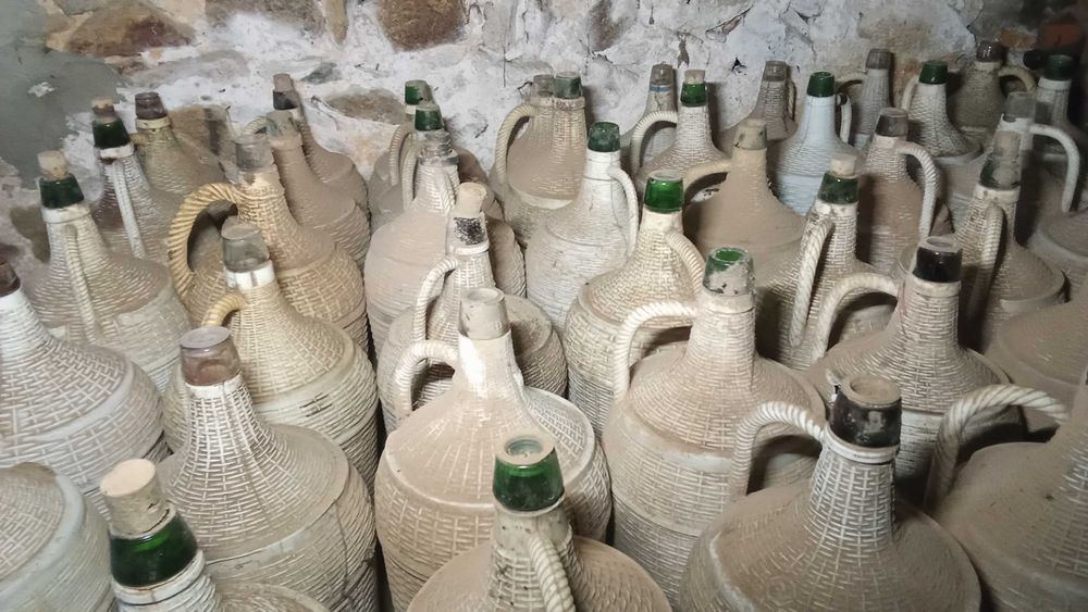 Garrafões de vidro revestidos a plástico