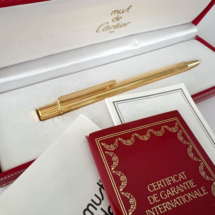Złoty długopis Cartier