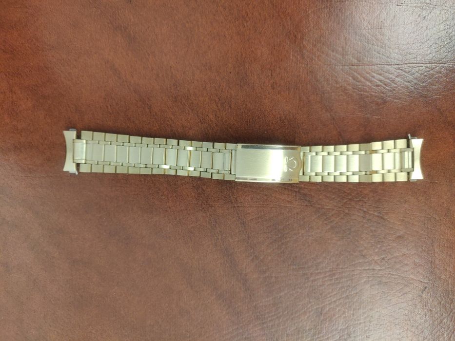 Bracelete Omega em aço plaqueada a ouro