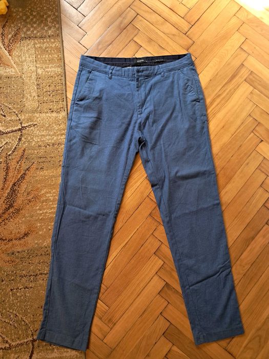 Spodnie meskie niebieskie, Reserved, slim, uszkodzone r. 34