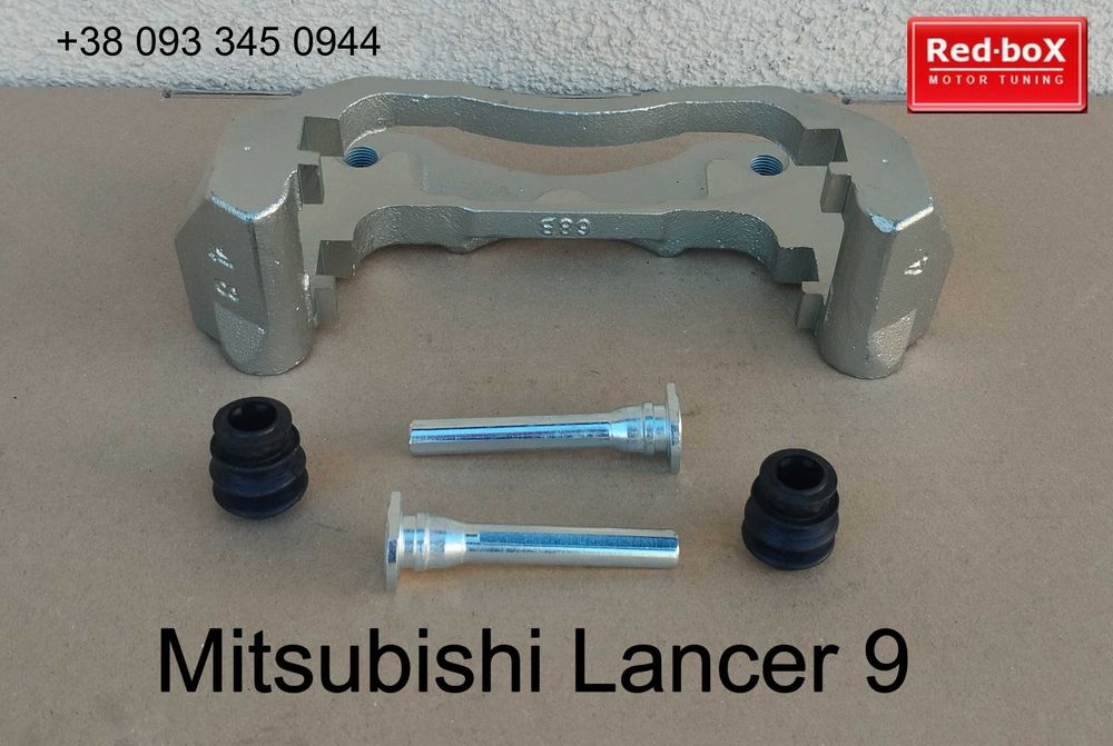 Скоба тормозного суппорта • Mitsubishi Lancer 9 • Перед