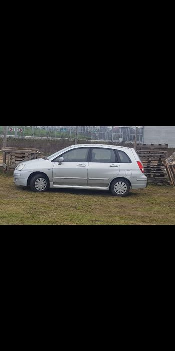 Blotnik przedni części Suzuki Liana lift