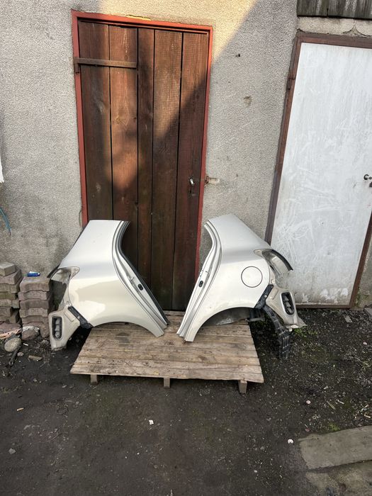 Błotnik ćwiartka prawa lewa tył tylna poszycie toyota yaris II 2 5a7