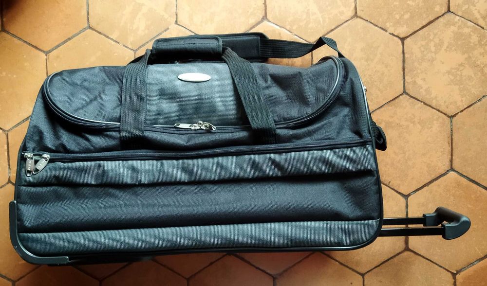 Saco de viagem com rodas e pega extensível