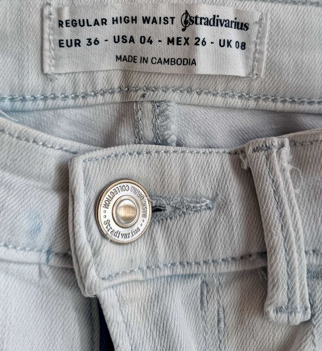 Spodnie jeans -stretch - białe w niebieskie plamy STRADIVARIUS” roz.36