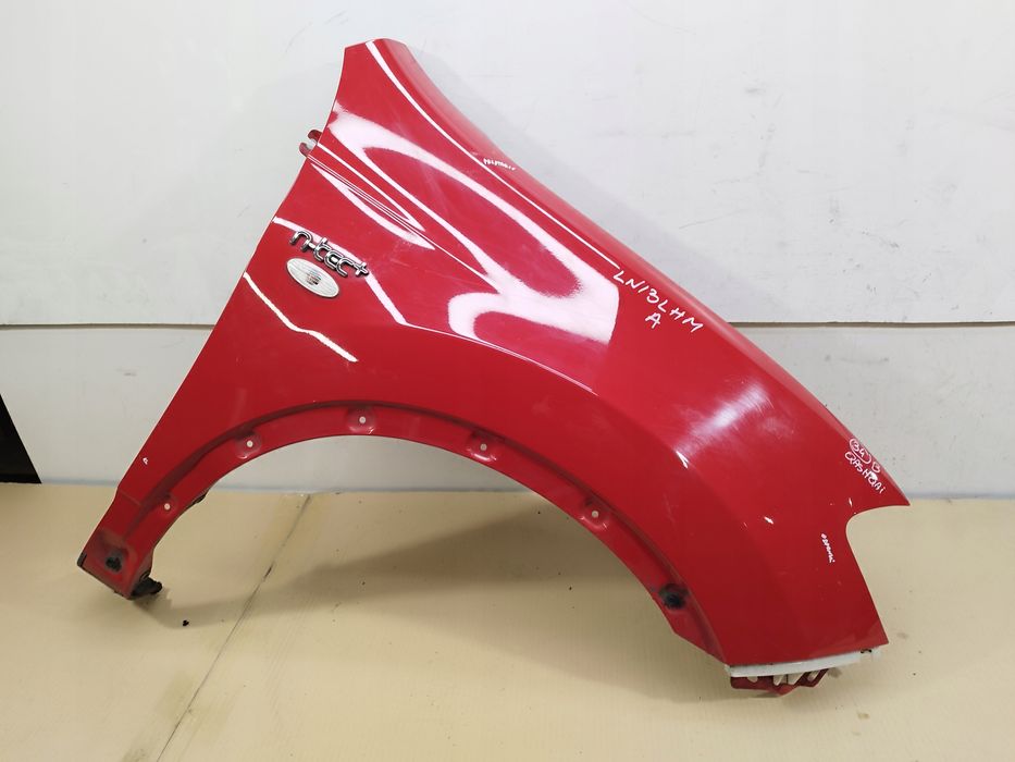 blotnik prawy przod nissan qashqai i j10 +2 lift 2010-2013 oryg kolor