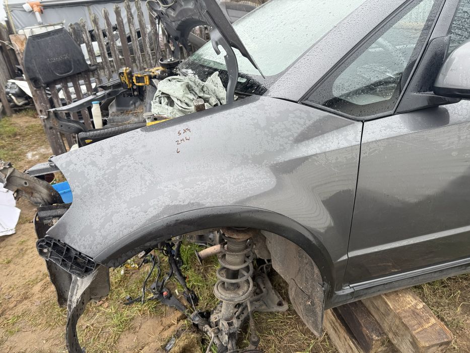 Suzuki sx4 zmw blotnik lewy prawy