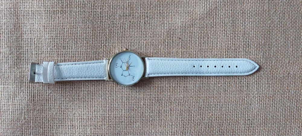 Relógio de pulso branco - cafeína