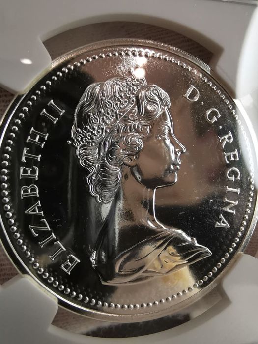 КАНАДА 1 долар 1975р. 100років м. Калгарі. СРІБЛО. NGS SP69 СЛАБ.