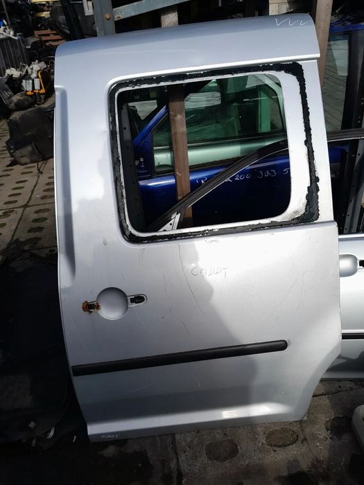 VW CADDY DRZWI LEWE BOCZNE LEWY BOK