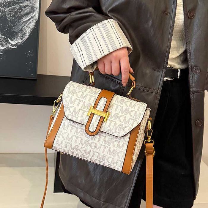 Torebka damska do ręki na ramię. Tylko teraz portfel męski gratis.