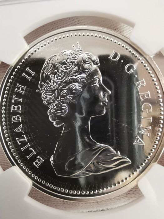 КАНАДА 1 долар 1975р. 100років м. Калгарі. СРІБЛО. NGS SP69 СЛАБ.
