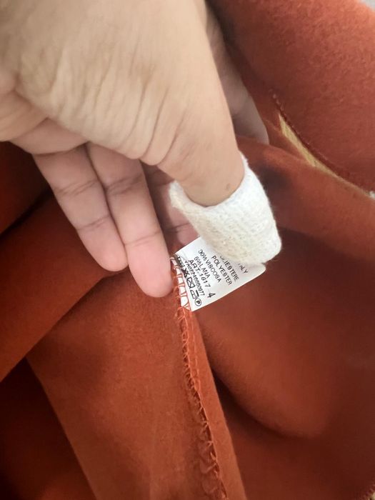 Capa com capuz em pelo