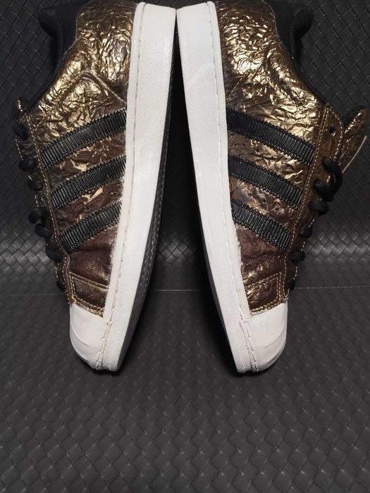 Adidas Superstar metallic foil gold.