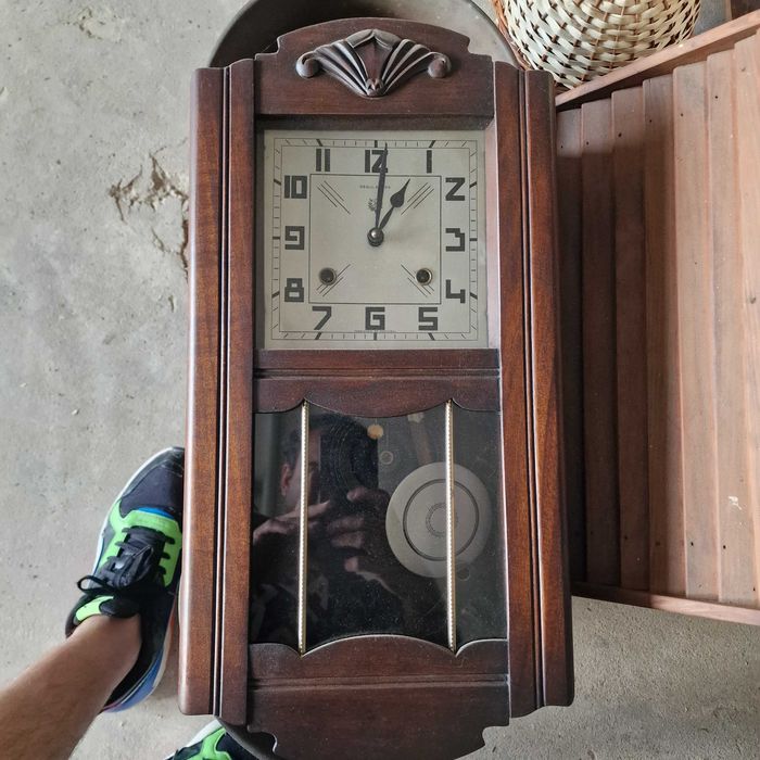 Relogio de parede com pendulo