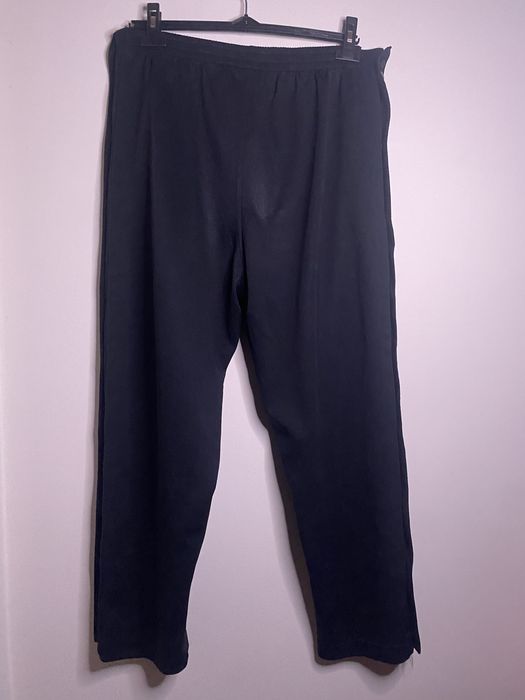 Calças Nike pretas com botões laterais (snap pants)