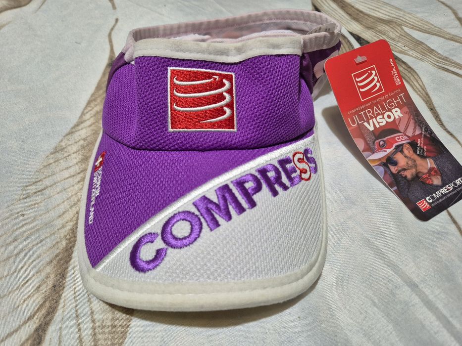 Pala corrida Compressport nova64284720083841122
