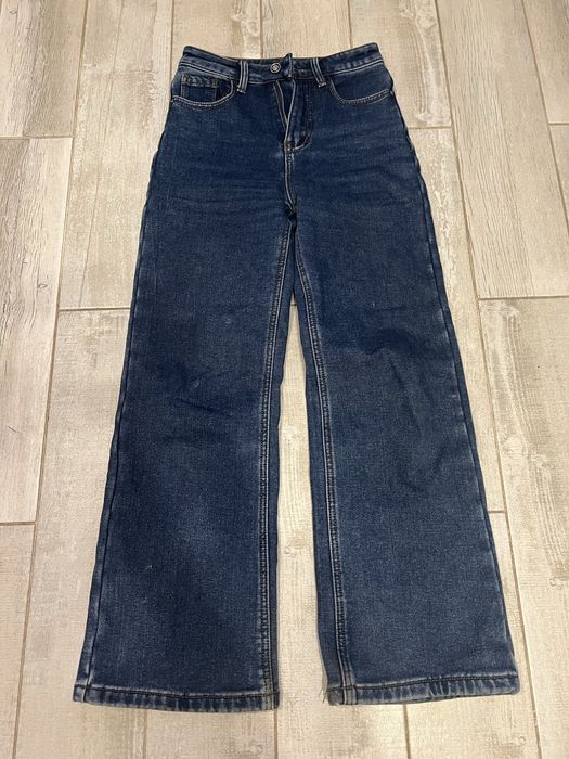 Модні темно-сині джинси кльош