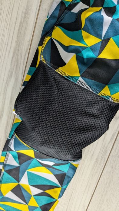 Wielokolorowe leginsy z kieszonką na zamek Crivit S 36