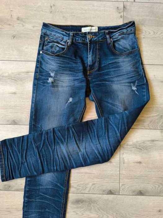 Jeansy męskie z dziurami .M.Sara.