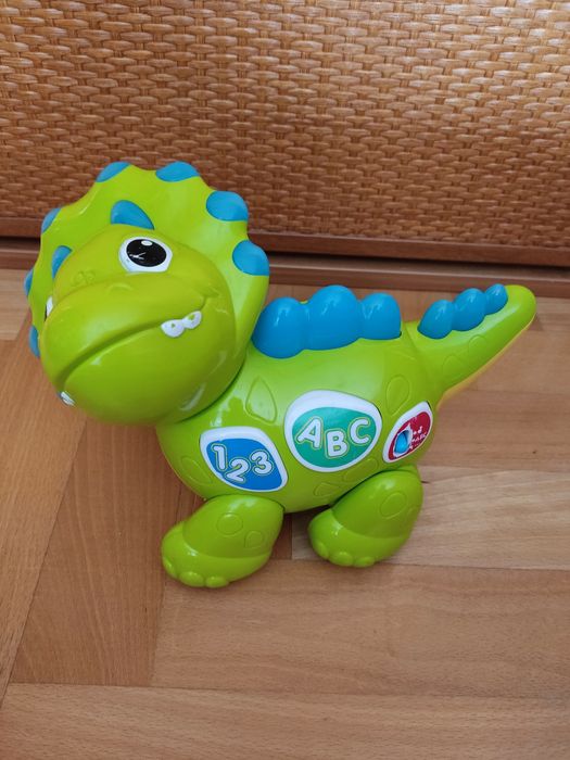 Grający i jeżdżący dinozaur