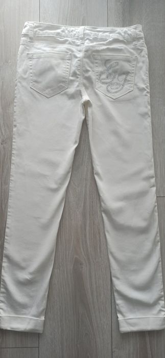 Białe z dżinsowego streczu rurki Guess. R 152 cm. Stan bardzo dobry.