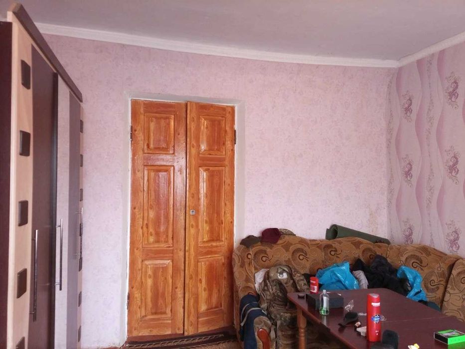 житловий будинок з господарськими будівлями