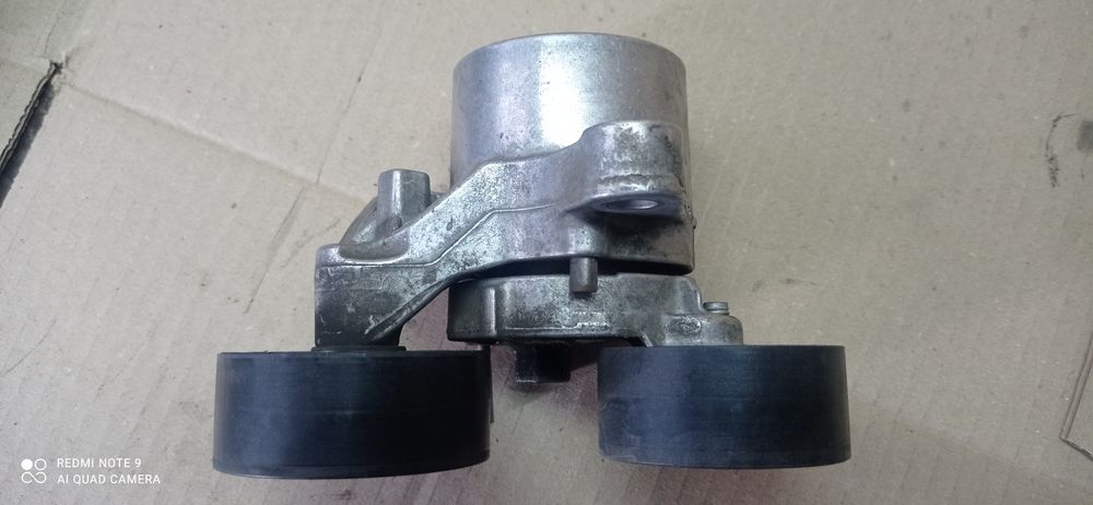 BMW. Натяжитель ремня генератора. 11287810807.