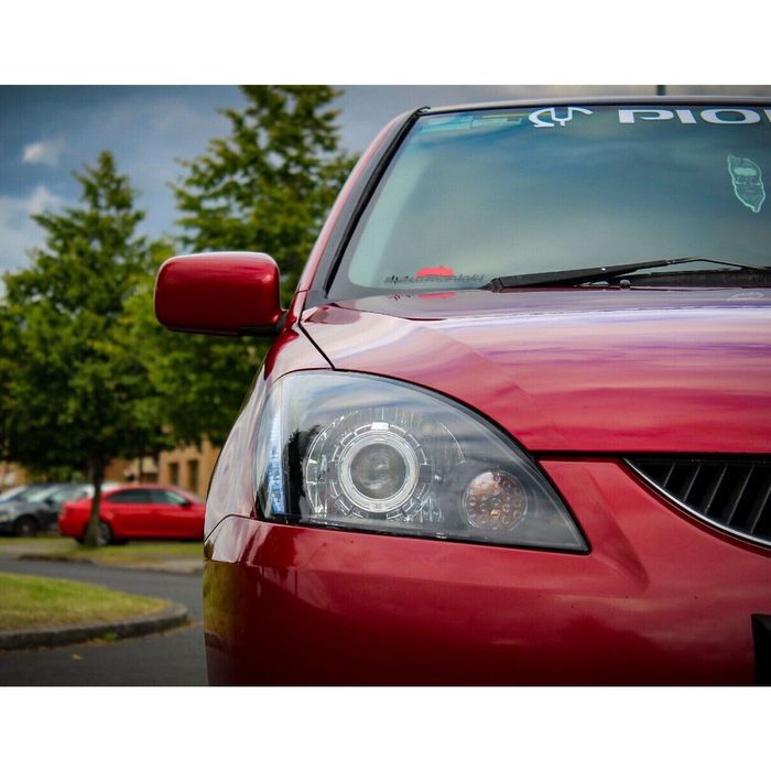 Новые фары с линзами Mitsubishi Lancer 9 (лансер)