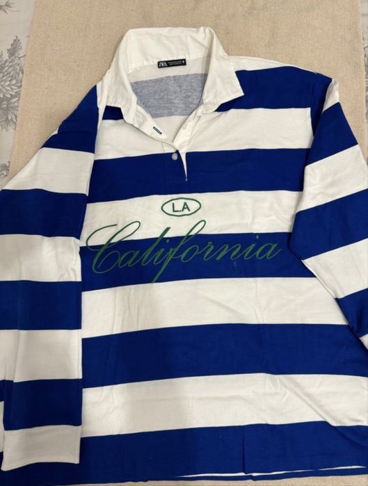 Polo às riscas azuis e brancas zara