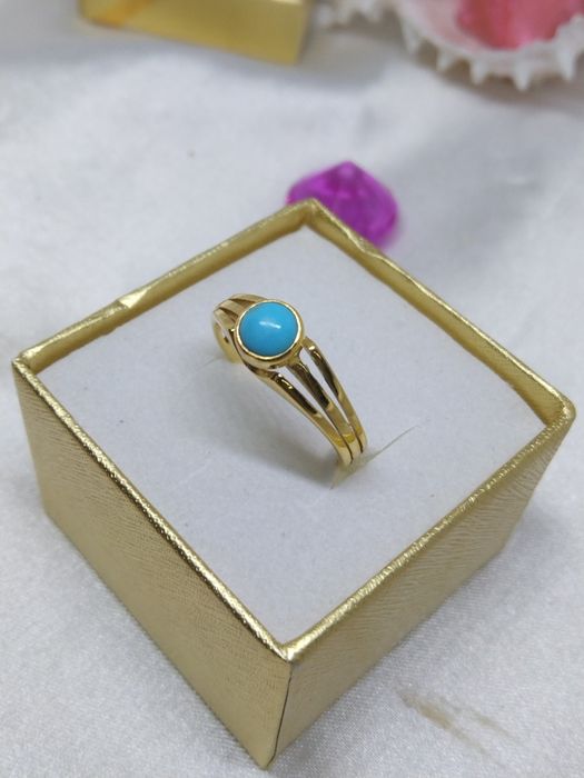 Piękny złoty pierścionek niebieskie oczko, złoto 333, r. 14