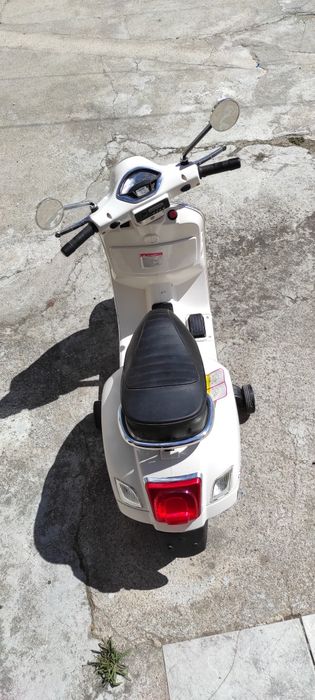 Vespe eléctrica criança