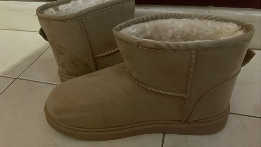 Botas com pelo novas