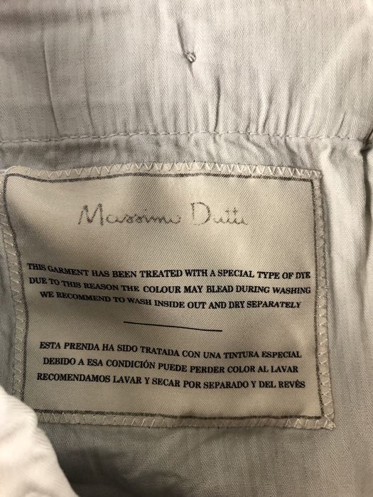 Kremowe chlopiece eleganckie spodnie chinosy Massimo Dutti