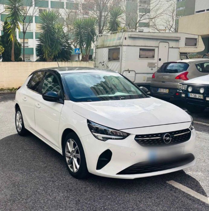 Opel Corsa - gasolina - mecânico - cor branca  com tecto preto