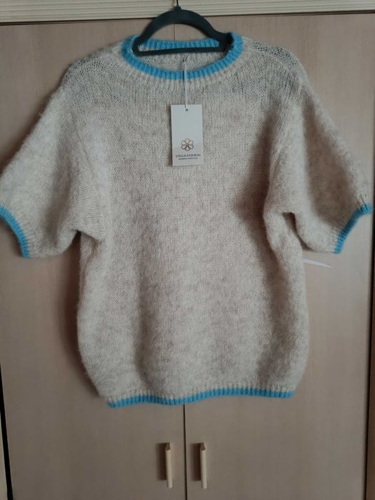 Nowy piękny  mięciutki Sweterek