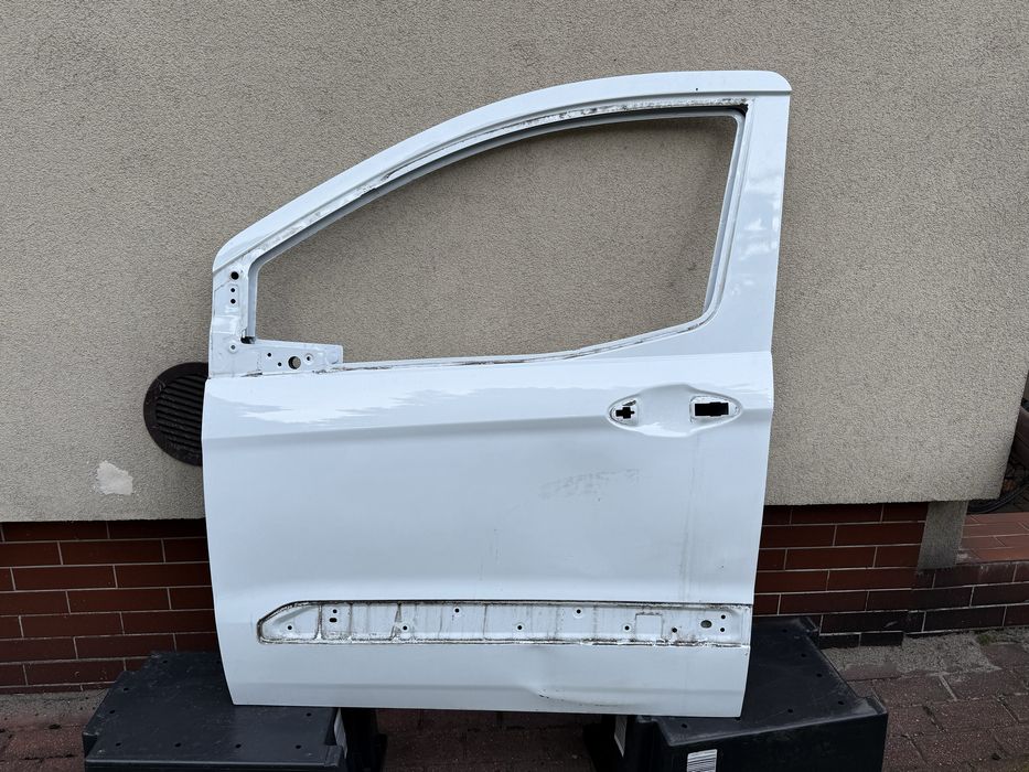 Ford transit courier MK2 drzwi lewe przód OE