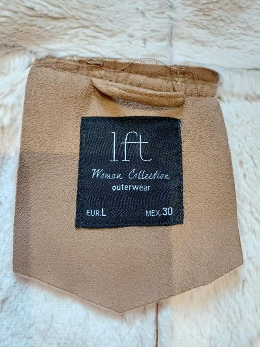 Colete de pele sintética
