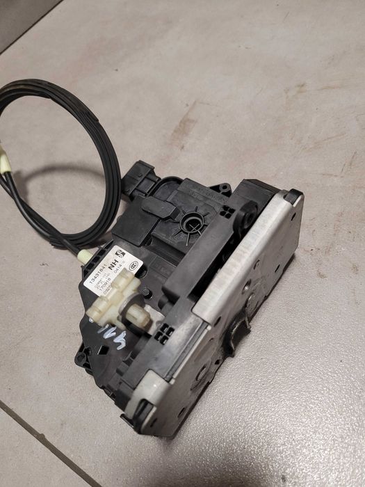 Zamek drzwi lewy przód lewy przedni Opel Corsa E 134.318.41 6-PIN