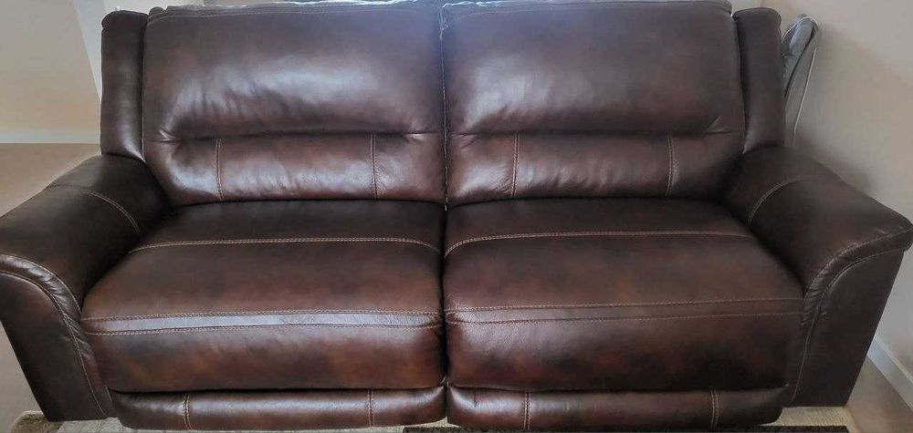 Leather reclining sofa, never used,  button control (seats/headrest)