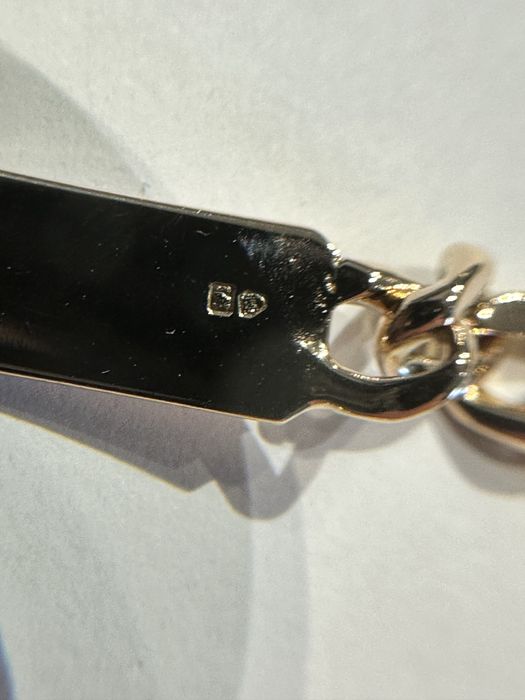 Pulseira em ouro macisso com chapa. 19,2 quilates