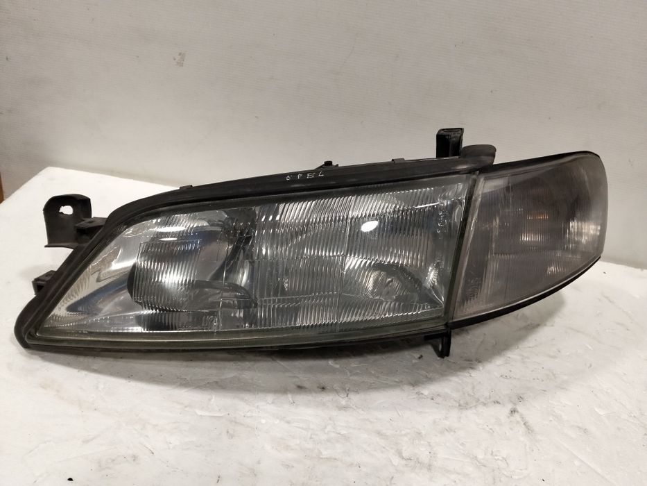 Farol Opel Vectra B ÓTICA esquerdo 1998