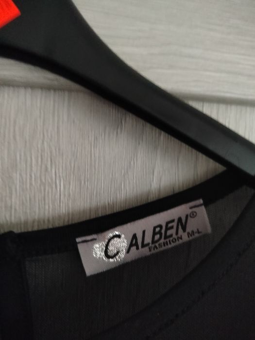 Sukienka czarna w cekiny na długi rękaw