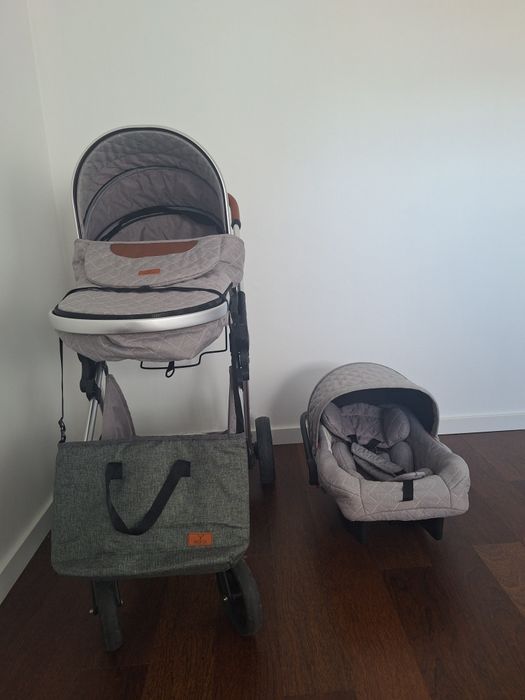 Carrinho de bebé junto com ovo, protecção da chuva e bolsa