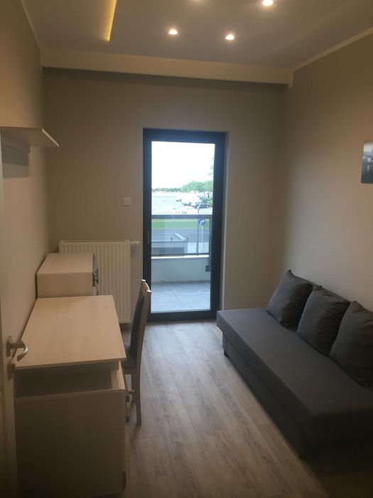 Pokój w apartamentowcu przy UMK
