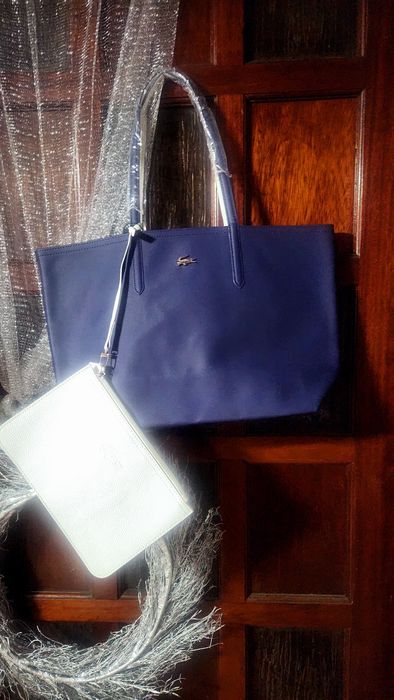 Bolsas lacoste a 60% novas com saco de embrulho