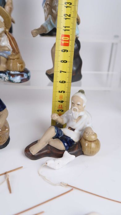 Conjunto de 18 figuras da China em Argila