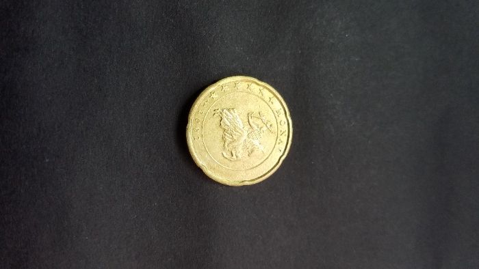 Moeda de 20 centimos Mónaco 2002 com defeito de cunhagem