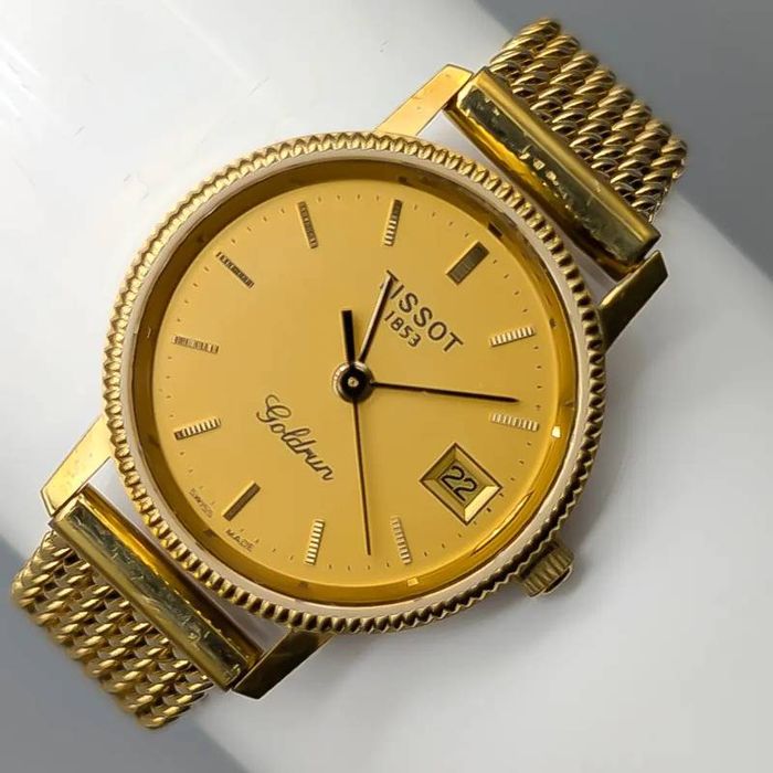 Relógio Tissot em ouro 18 quilates; 33.8 gramas; 16cm